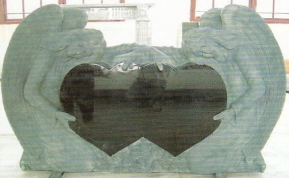 Granite Tombstone with two angels and a jet black heart
