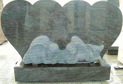 Upright headstone with two hearts and two cherubs